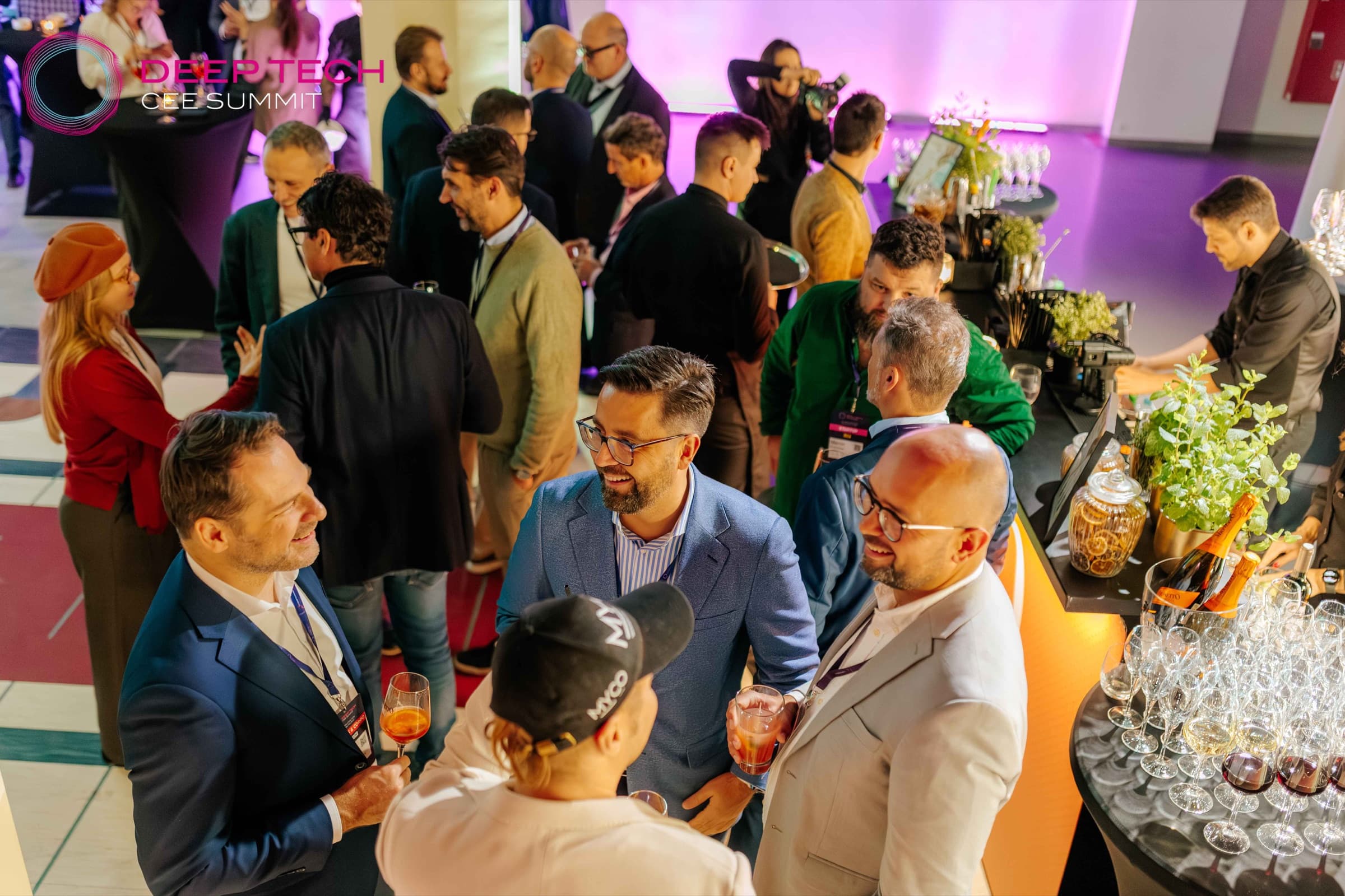 Guests talk at the bar during the evening reception of Deep Tech CEE Summit 2025
